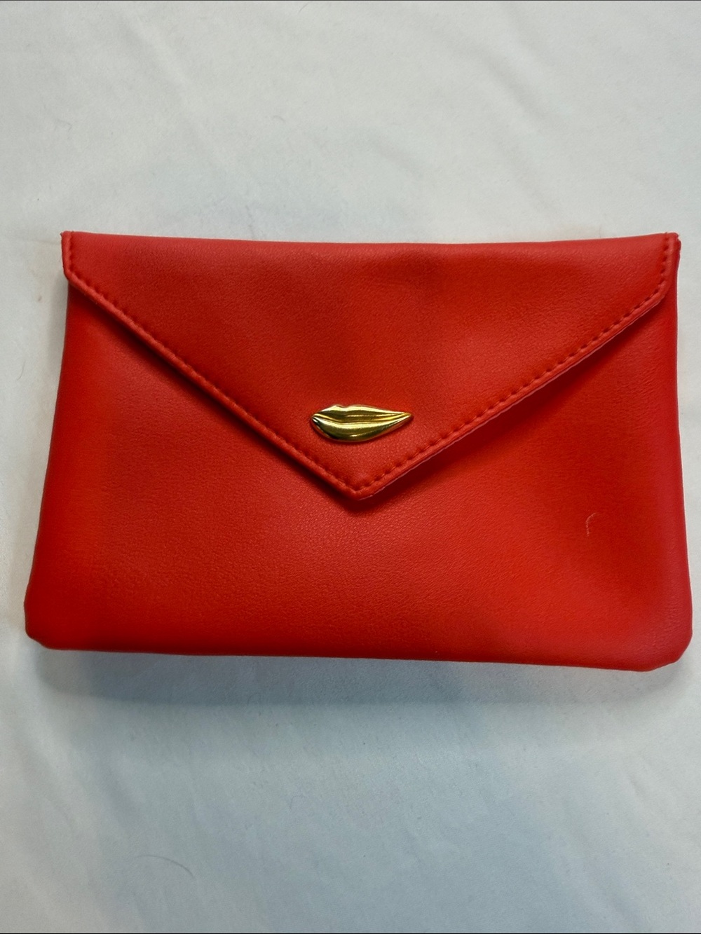 ipsy Red Envelope Clutch with Gold Lip Detail